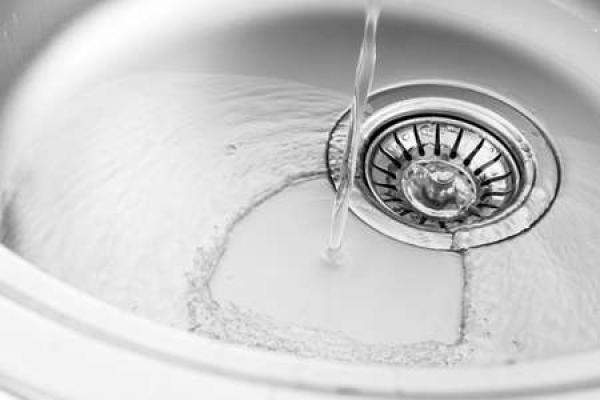 Water pouring into a kitchen sink